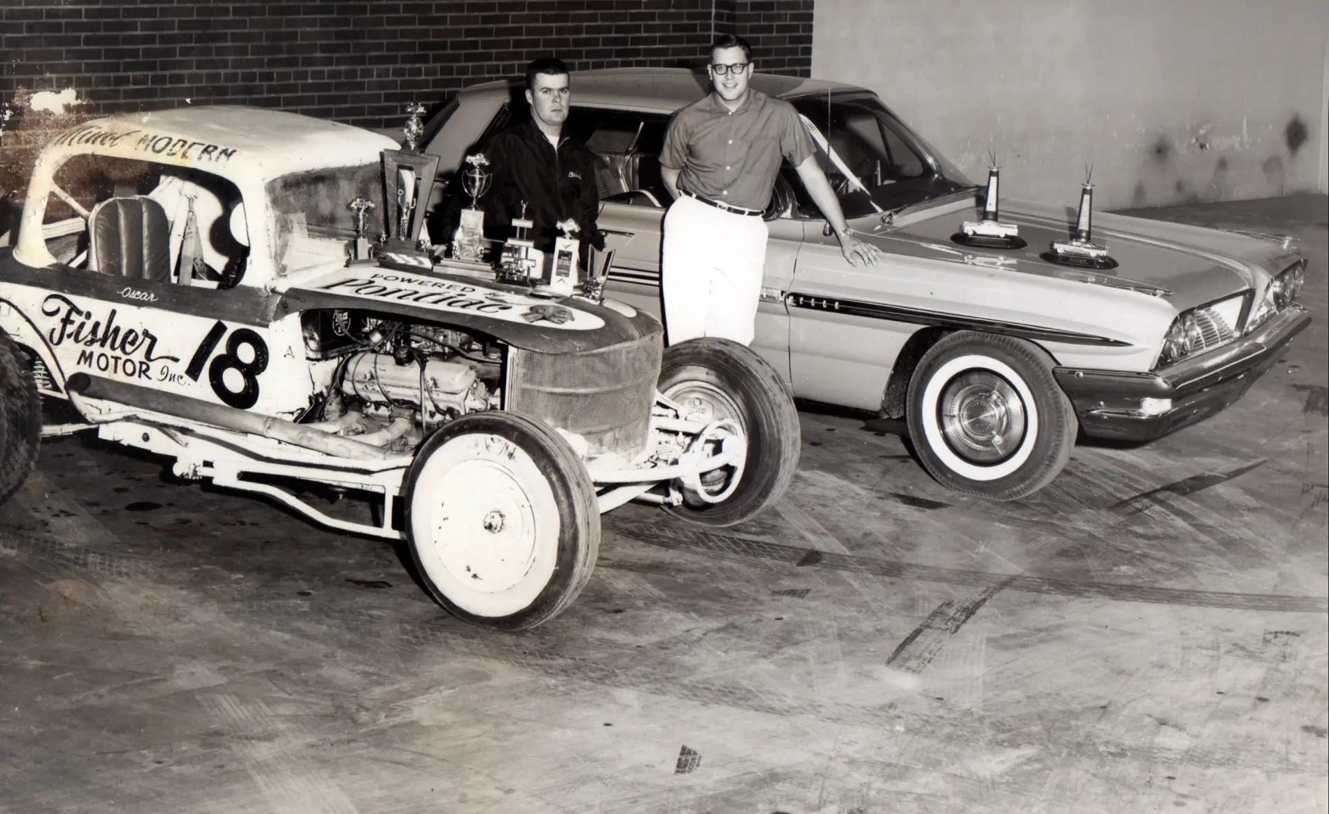 The Fisher Motor No. 18 race car with trophies